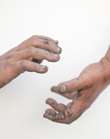 The two dirty hands showed signs of gesture.の写真素材