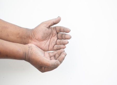 The dirty hands of the people who show the gesture of askingの写真素材