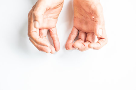 Both hands of the elderly are on an empty white spaceの写真素材