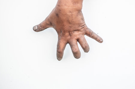 The dirty man's hand shows a meaningful gesture.の写真素材