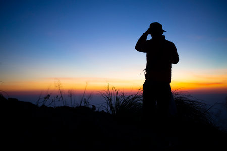 People silhouettes against colorful backgroundの写真素材