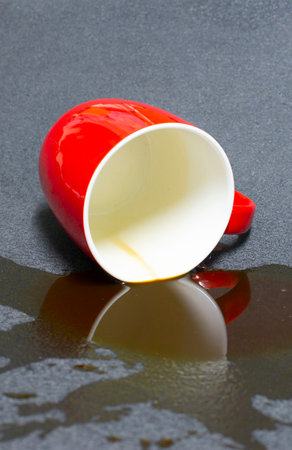 Spilled coffee cups on a black background.