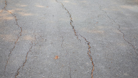 Cracks on the concrete road surface. Outdoor locations.の写真素材