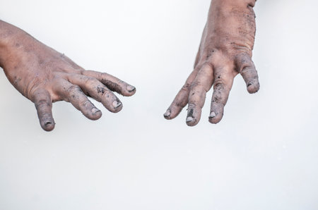 This concept expresses the meaning of both hands that are dirty, grabbing things.の写真素材