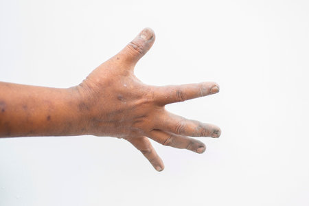 Dirty finger and hand on a white backgroundの写真素材