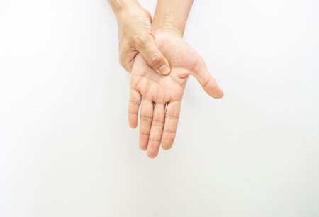 showing signs of the muscles in the hands and fingers of a personの写真素材
