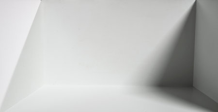 The direction of light and shadow of an empty white room space.の写真素材