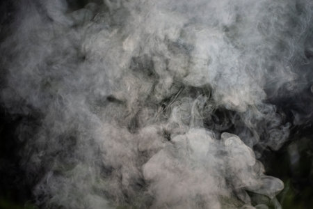 white smoke against black background
