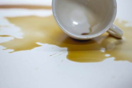 Coffee water spilled on a white background.の素材 [FY310187984676]