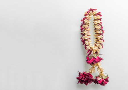 A wreath of wilted old flowers on a white background with empty space.の写真素材