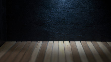 Black background and wooden floor with empty spaceの写真素材