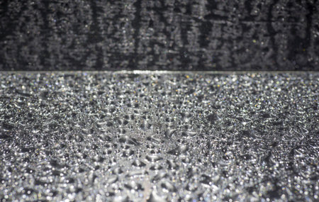 Background with black floor with silver liquid