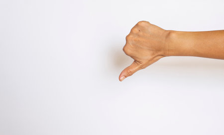 The finger of a woman showing the meaning on a white background