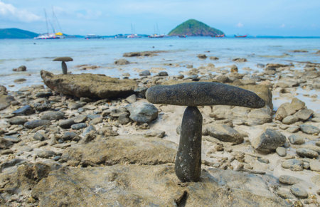 Coastal scenery and natural rock formations that are stacked together with balance