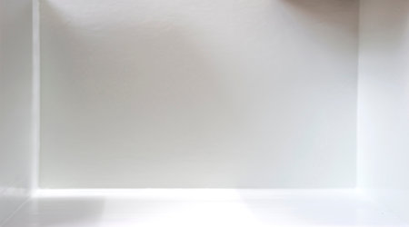 Light and shadow in the backdrop of an open white roomの写真素材