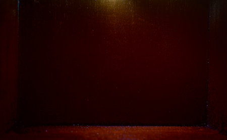 Background image of red and sparkling light in a black room with space.の写真素材