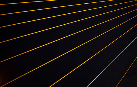 yellow object line against dark black backgroundの写真素材
