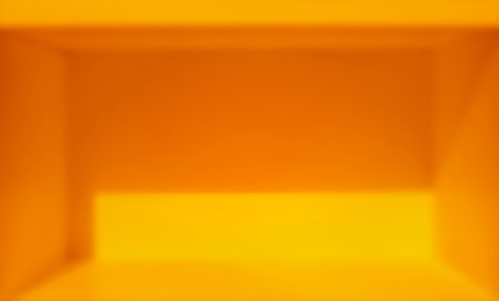 Blurred image, orange-yellow light and shadow in an empty room.の写真素材