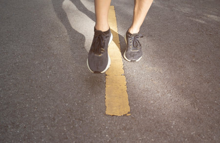 foot pose human leg person jogging Forward on the concrete road surface in outdoor places.の写真素材