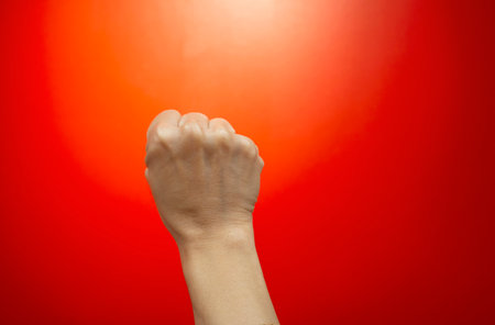 Concept image, hand and fingers human gestures symbols on live colored background with empty space.の写真素材