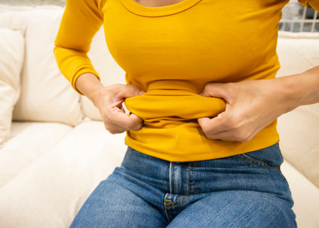 The image shows the obese, excess fat of the female body.の写真素材