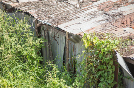 The wall and fence is old and dilapidated in an outdoor location.の写真素材