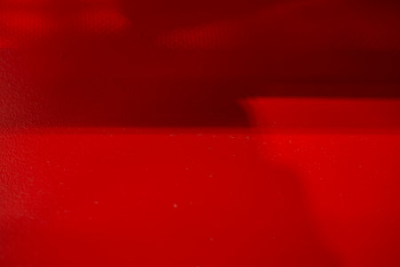 red background with light and shadow textureの写真素材