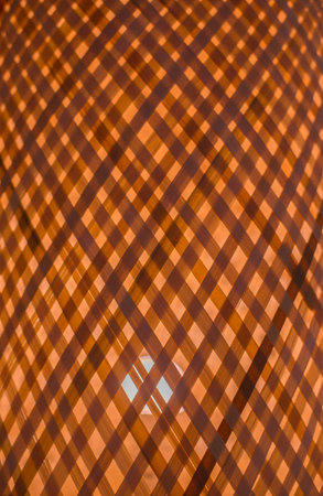 The light shines inside the basketry lamp.の写真素材
