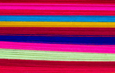 The textured pattern of the embroidered cloth is bright and colorful.の写真素材