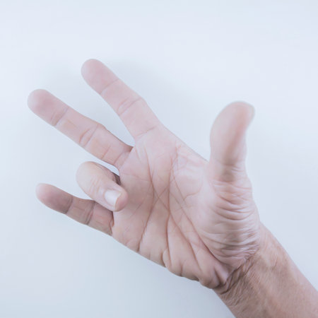 Finger of seniors who have problems trigger fingers on a white background.