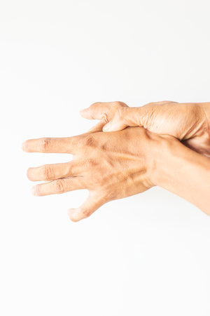 Rough and dry skin of hand Elderly man showing finger injury gestureの写真素材