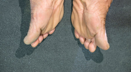 Feet and toes of older people with wrinkled and dry skin.の写真素材