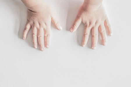 child's hand and finger on a white backgroundの写真素材
