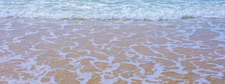 Sea waves on the surface of the coastの写真素材