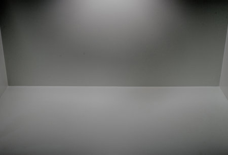 Image of a white scene with empty space with light and shadow.