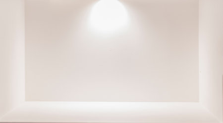 Light and shadow in the background of a white interior with an open space.の写真素材