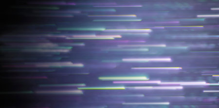 Blurred image of brightly colored beams of purple-blue-orange-yellow-green moving in straight parallel lines.の写真素材