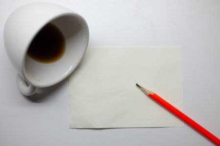 The picture shows the concept of spilled coffee mugs. paper and pencilの写真素材