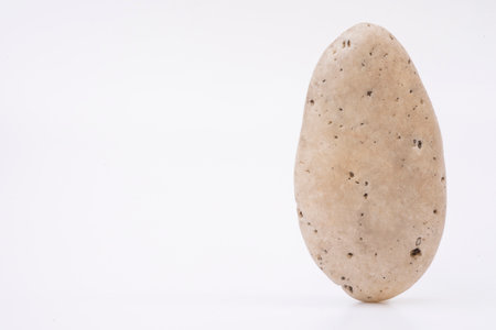 Naturally shaped rock objects on a white background.の写真素材