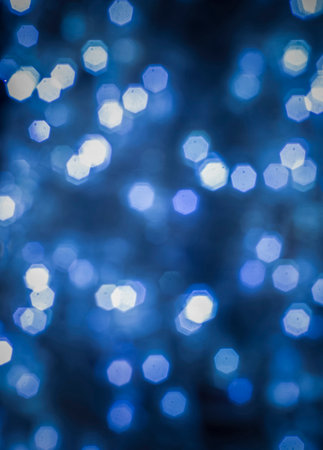 Background image with colorful sparkling blue and bokeh lights.の写真素材