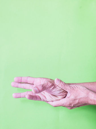 The muscles in the body have symptoms of peripheral neuropathy in the hands and fingers.の写真素材