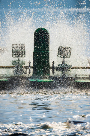Water splashes from a water turbine to add oxygen to the water.の写真素材