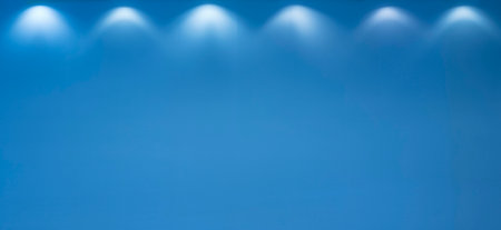 Spotlight shines on blue background