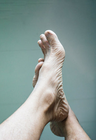 Feet bare pose of an older personの写真素材