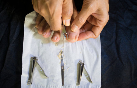 Close-up of a person trimming his own toenails.の写真素材