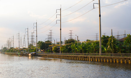 Electricity pylons on the bank of the Chao Phraya River.の写真素材