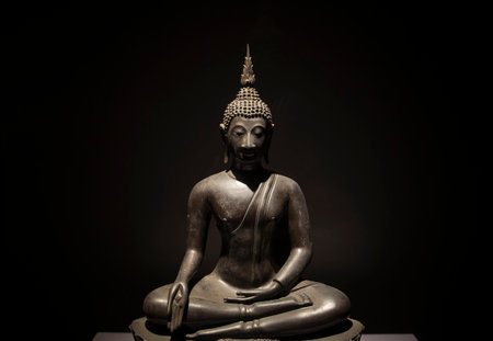 Buddha statue on black background, Wat Mahathat, Bangkok, Thailandの写真素材