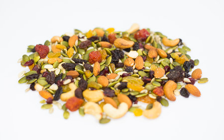 Mix of nuts and dried fruits on white background, healthy food.の写真素材
