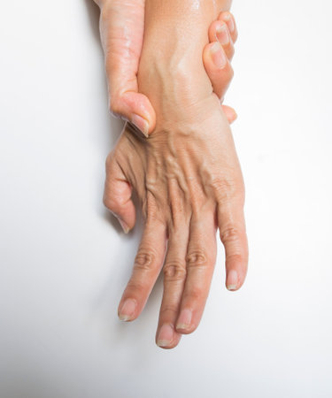Hands of a woman and a man on a white background.の写真素材