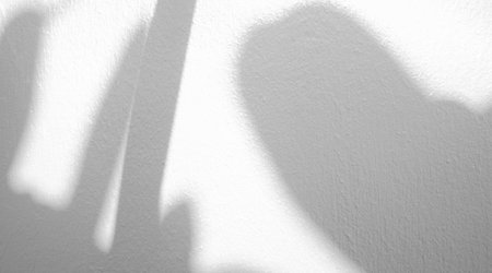 White wall texture with shadow background.